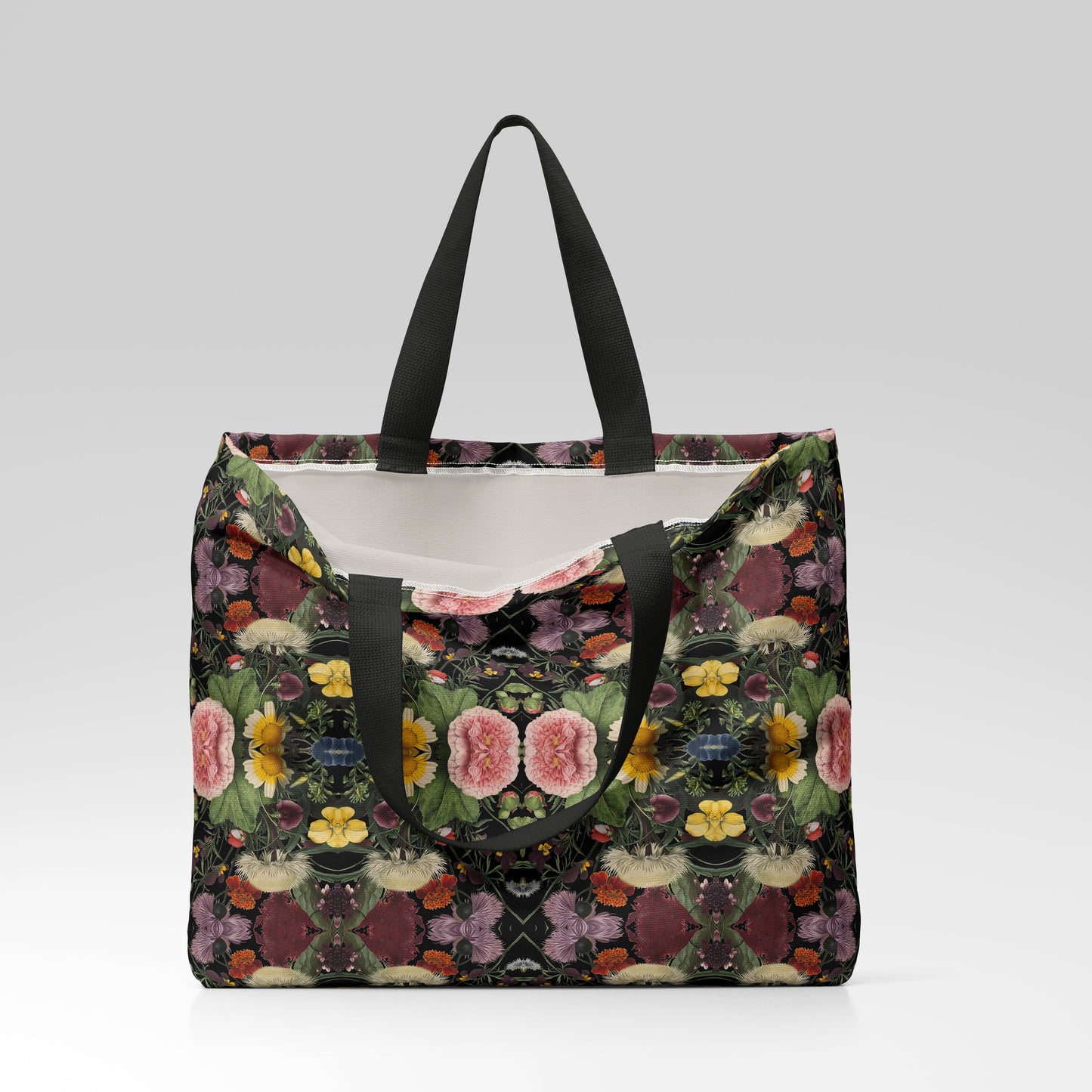 Floral patterned tote bag with black handles on a light gray background