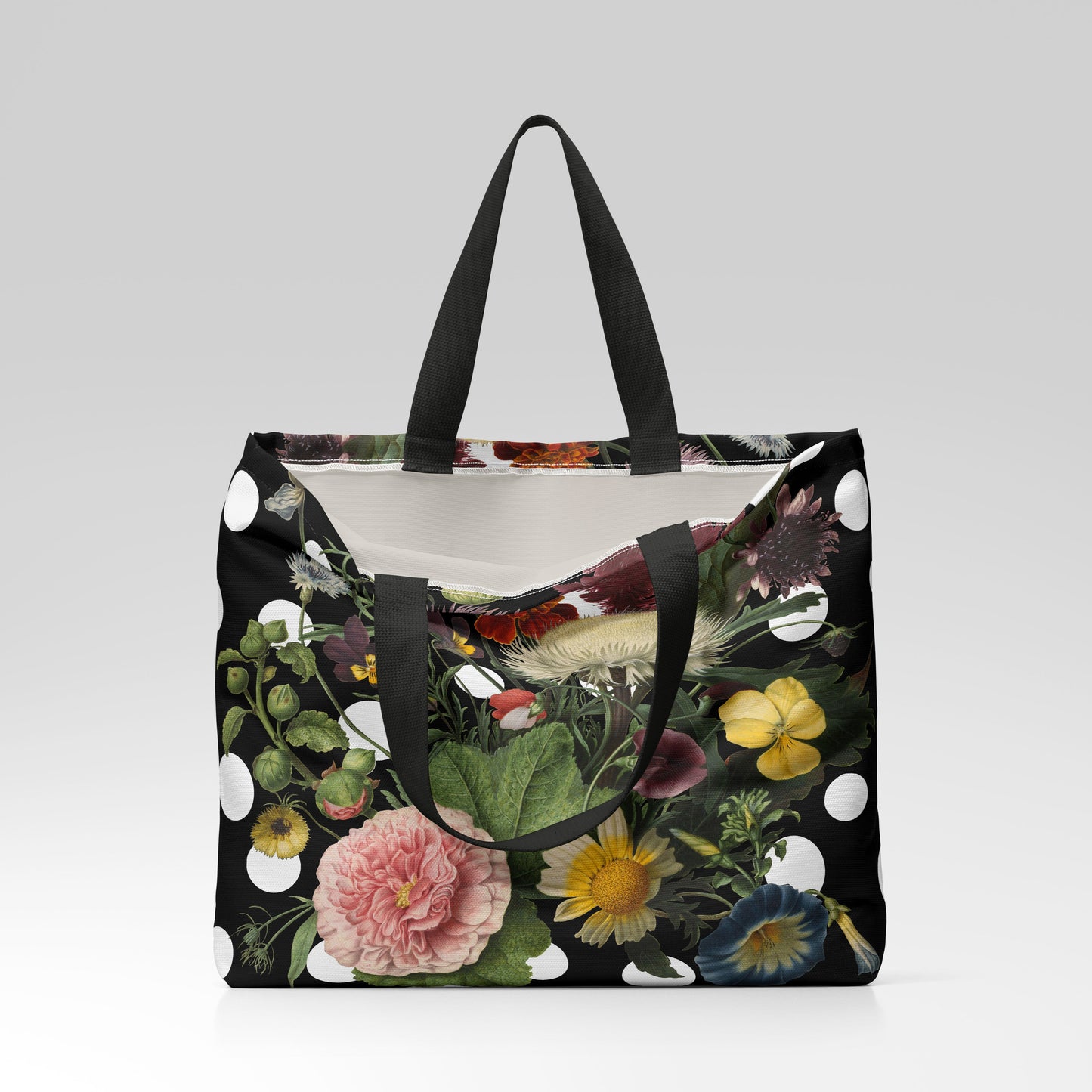 Floral-patterned tote bag with black handles on a light gray background