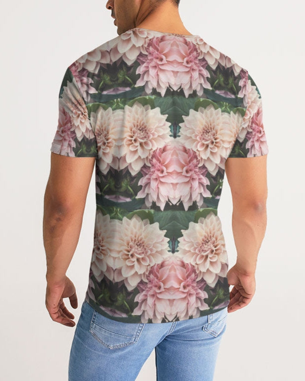 A man wearing a floralis no 26 men’s short-sleeved tee with a vibrant mirrored pattern of pink white dahlias