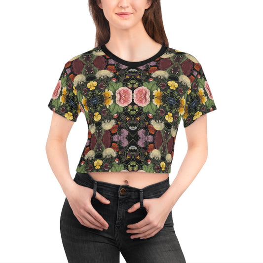 Woman wearing a floral patterned crop top on a white background