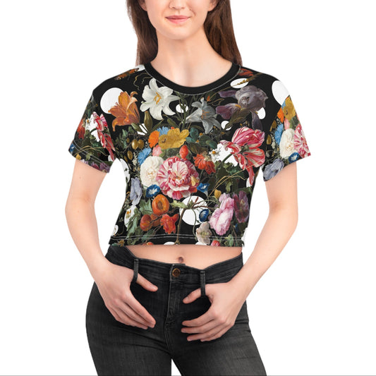 Woman wearing a floral patterned crop top on a white background