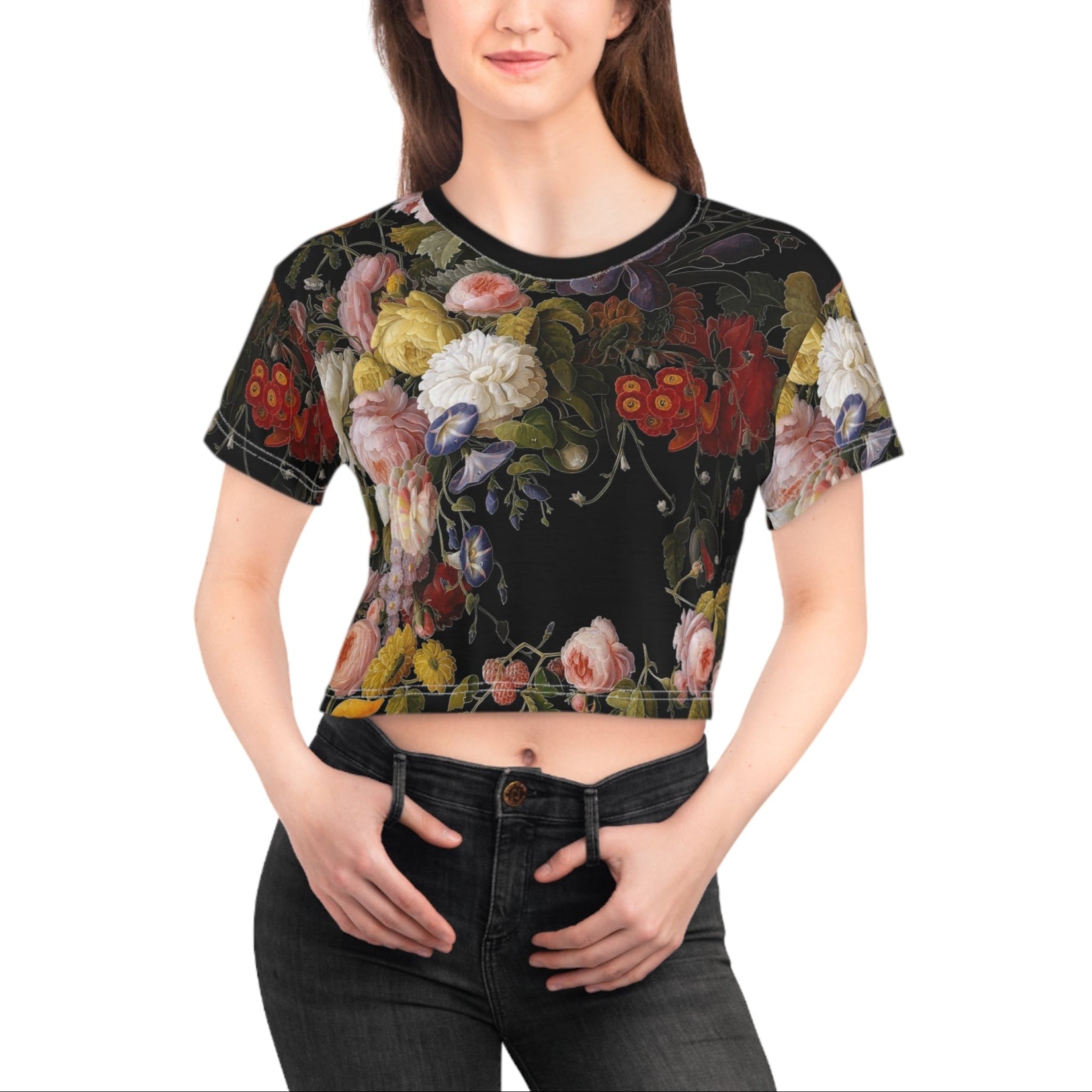 Woman wearing a black floral crop top on a white background
