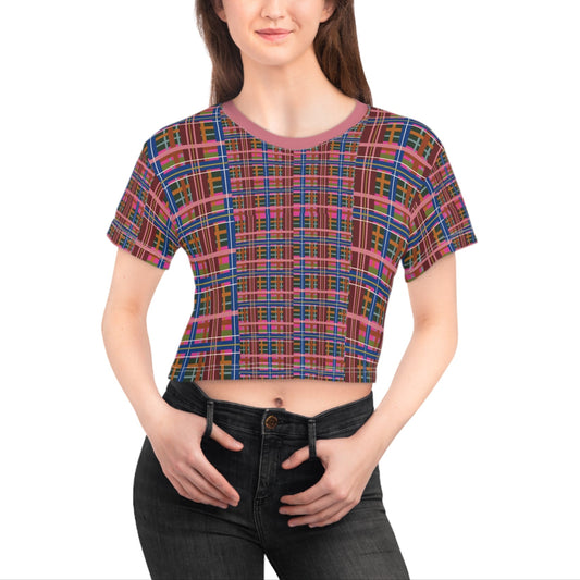 Woman wearing a colorful plaid crop top on a white background