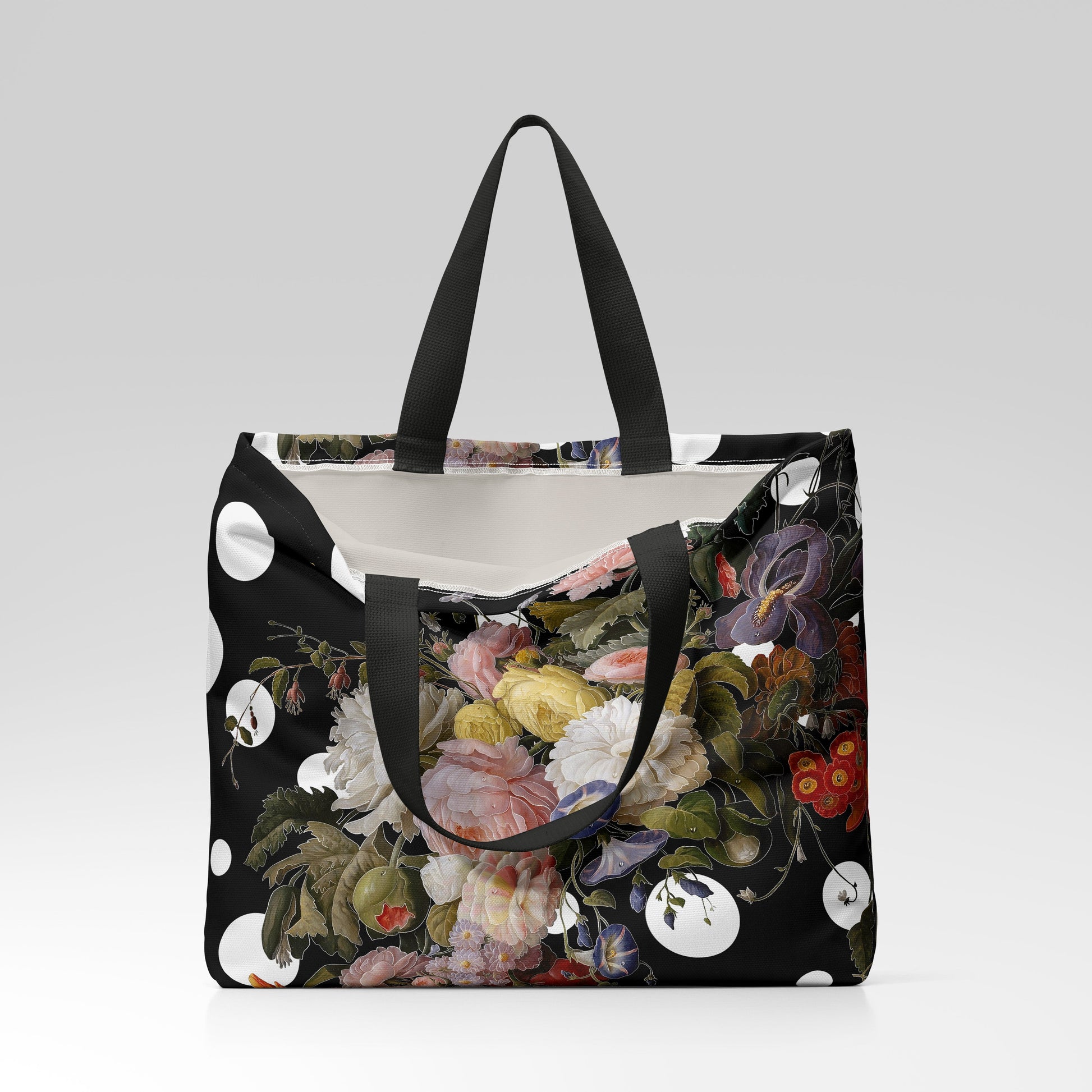 Floral tote bag with black handles on a light gray background
