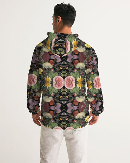 A black hooded botanica no 1 men’s windbreaker with vibrant pink yellow purple green floral pattern on the back