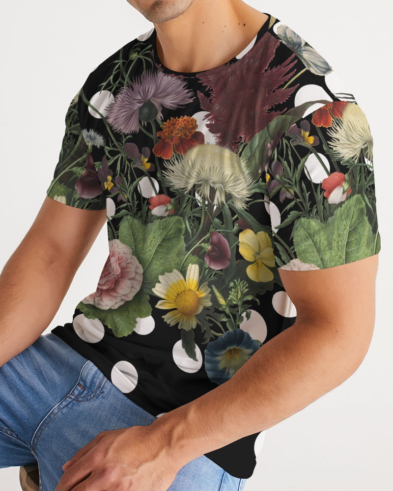 Black short-sleeved botanica pop men’s tee with vibrant purple yellow pink blue floral print and white polka dots
