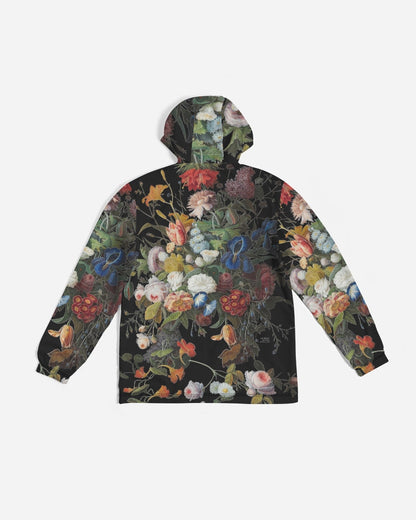 Black hooded Dutch Redux No 1 men’s windbreaker with vibrant multicolor floral print on dark green foliage background