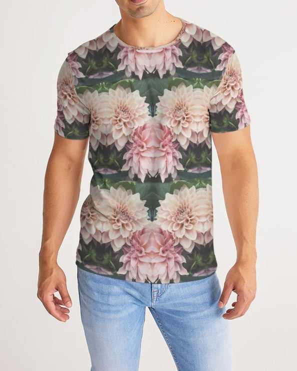 A man wearing floralis no 26 men’s tee with symmetrical pink and white dahlia floral pattern on dark green fabric
