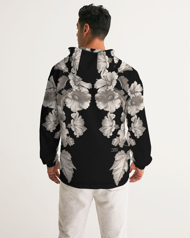 Back of noir botanica no 1.2 men’s black windbreaker with bold grayscale floral pattern featuring detailed blossoms and leaves