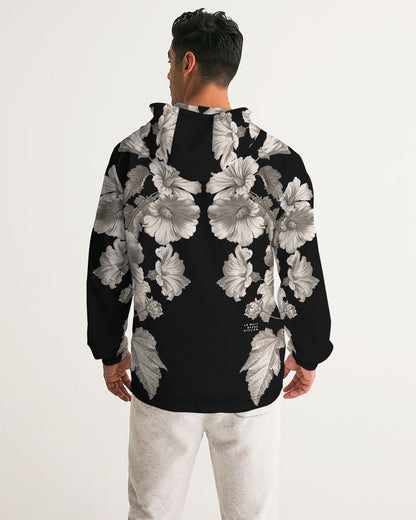 Back of noir botanica no 1.2 men’s black windbreaker with bold grayscale floral pattern featuring detailed blossoms and leaves