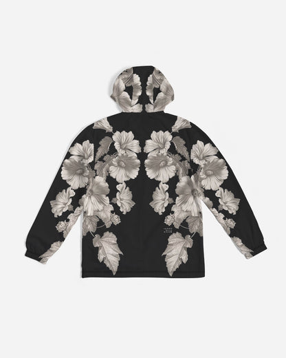 Noir Botanica No 1.2 men’s black windbreaker hoodie with detailed grayscale floral pattern on front and sleeves