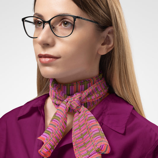 A vibrant pink plaid chiffon long scarf with green stripes tied neatly around the neck
